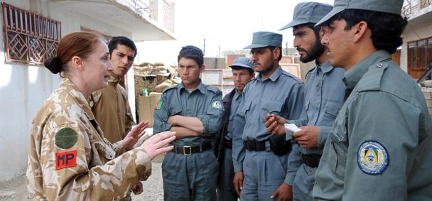 A Royal Military Police (RMP) Corporal instructs some of the up and coming Afghanistan police.  This photo was taken on February 21, 2010 in Musa Qala, Helmand.