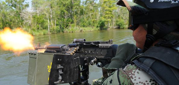 Primero Franco, a Colombian marine, fires an M-60 machine gun during a field training exercise June 30, 2009. (U.S. Navy photo/R.J. Stratchko)
